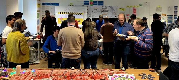 A group of staff from the digital team socialising and eating